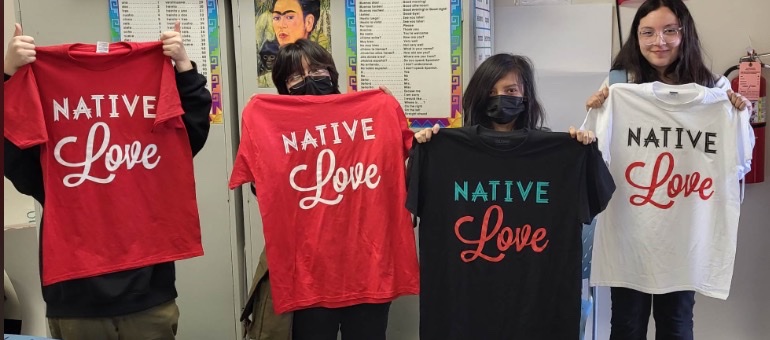 "Group photo of 4 Native youth holding up NativeLove t-shirts"