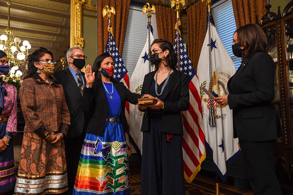 Deb Haaland (Laguna Pueblo) wears traditional ribbon skirt as she is sworn in as Secretary of the U.S. Department of Interior by U.S. Vice President Kamala Harris on March 18, 2021. (Photo courtesy of U.S. Department of the Interior.)