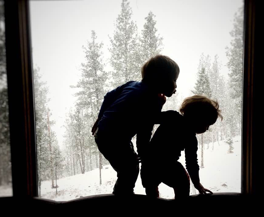 Violet’s sons watch the snowfall together.
