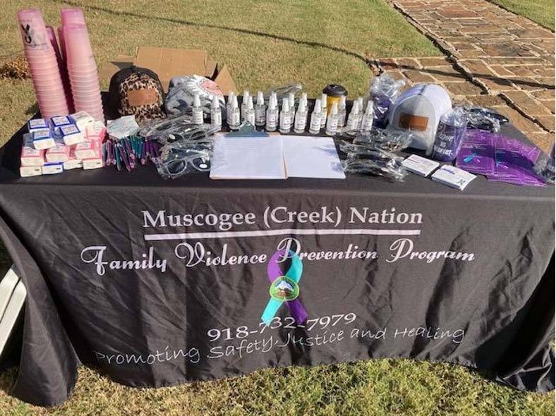 An outreach table set up for the Muscogee (Creek) Nation Family Violence Prevention Program in Okmulgee, Okla., in October 2020. (Photo courtesy of Muscogee (Creek) Nation FVPP Facebook page).