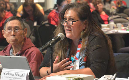 Photo of Catherine Edwards speaking into a microphone.