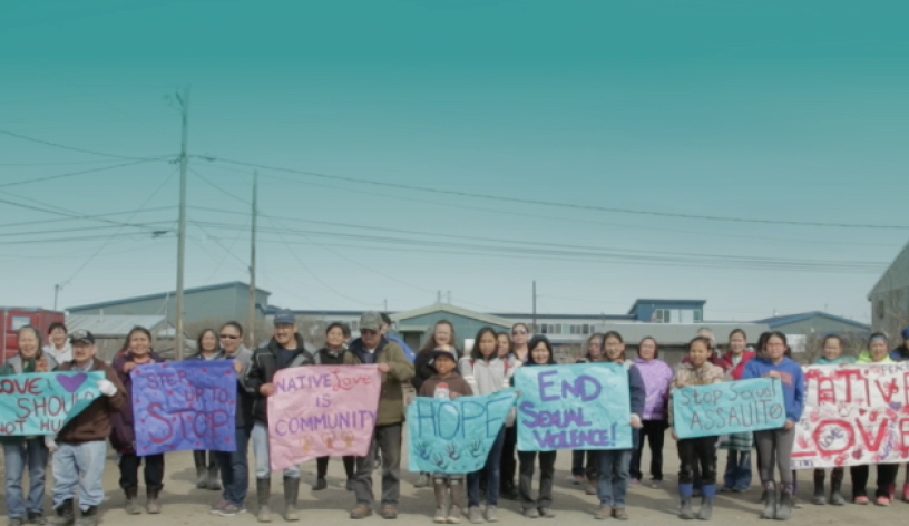 Image of protesters with faded teal background